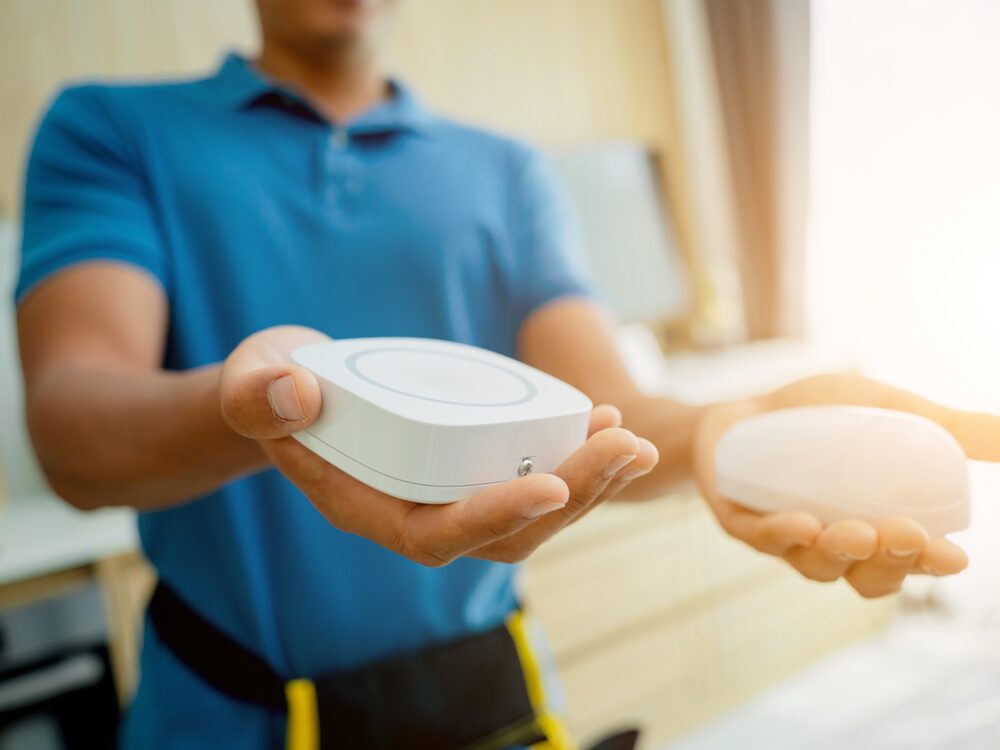 A technician handing over a finished smart home device