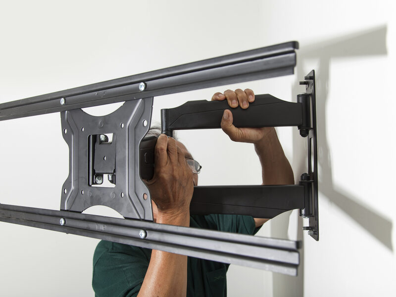 A wall-mounted screen in a living room